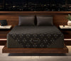 Beautyrest Black Hybrid Series Five XCS Plush Mattress in a bedroom setting.