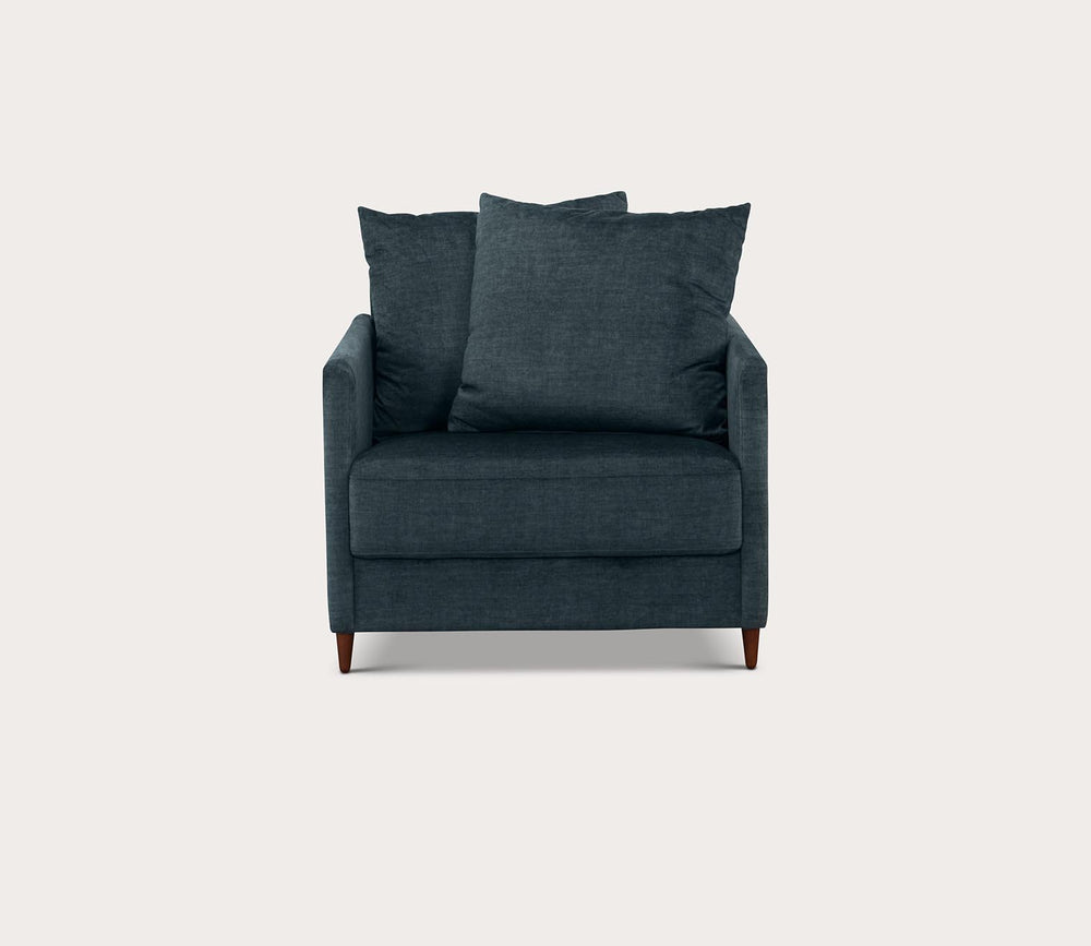 Emerald armchair with two cushions on a light gray background