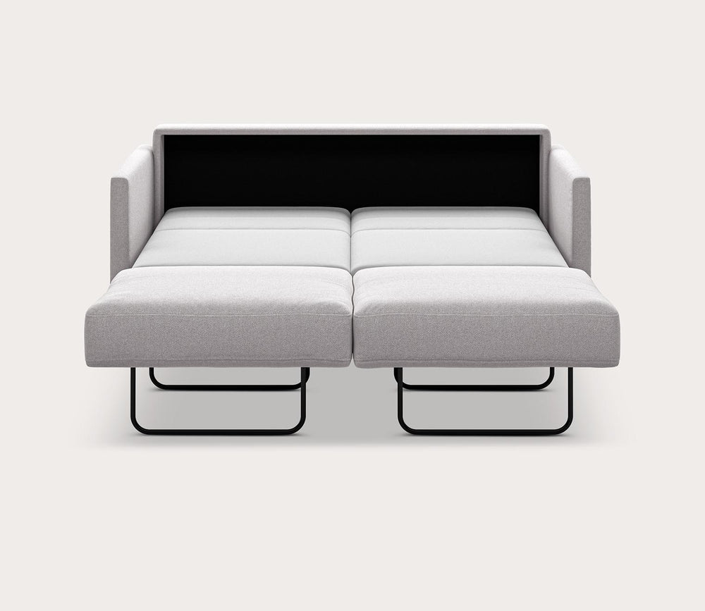 Gray sofa bed with black headboard on a white background