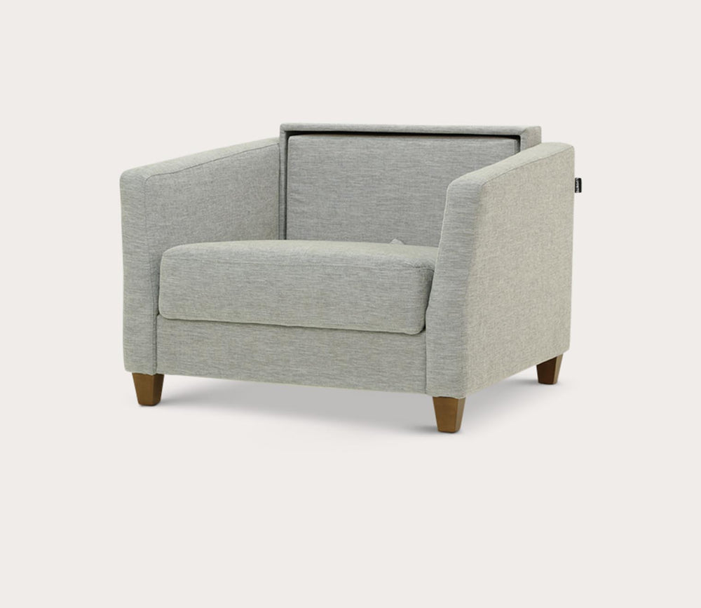 Gray armchair with a small table on a white background