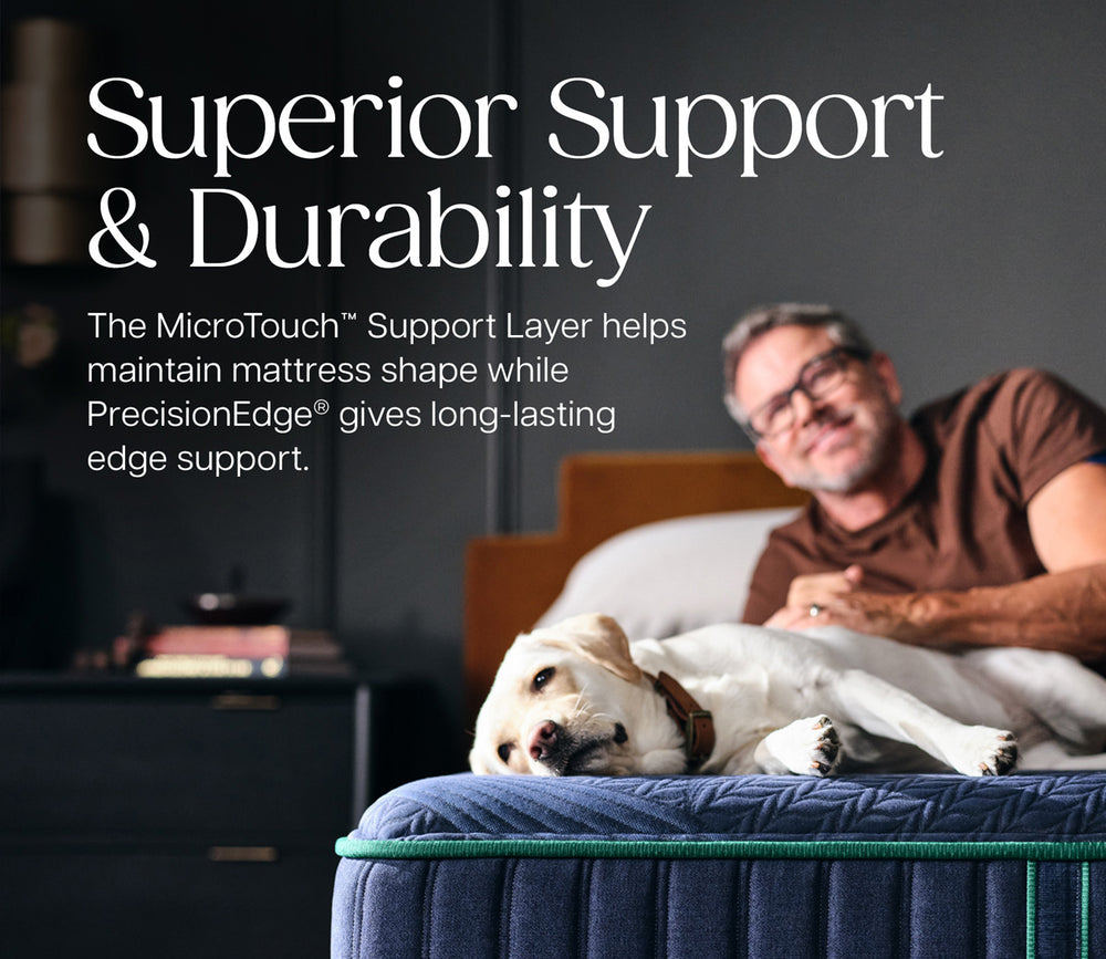 Man, and dog relaxing on Stearns & Foster Reserve Mattress