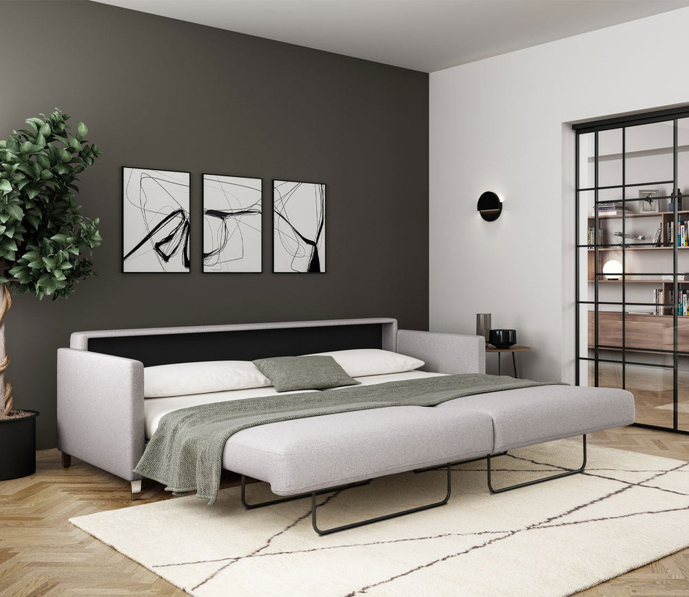 Elfin Sleeper Sofa in Light Gray (Renee) fully extended into a bed with bedding and pillows.